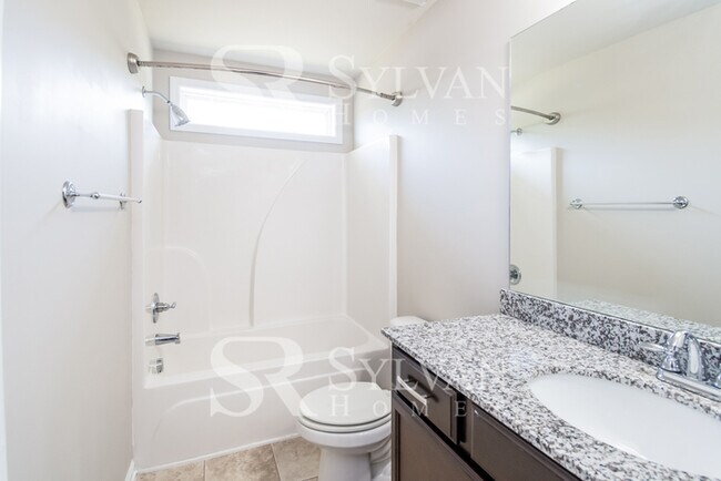 Building Photo - Embrace the charm of this 4 BR, 2.5 BA home