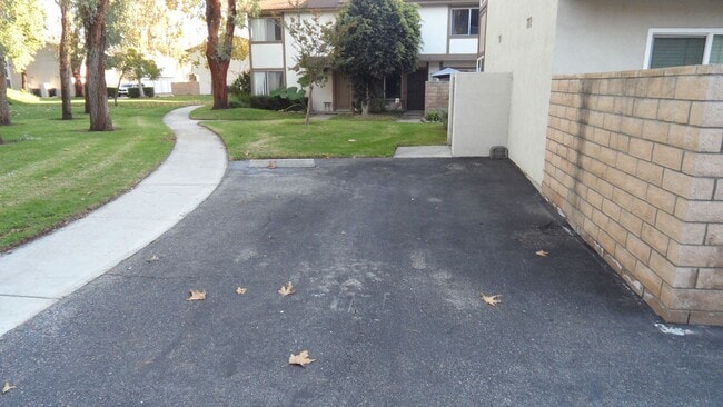 Building Photo - REMODELED 2BR; 1BA end unit condo w/ 1 car garage & 1 parking space