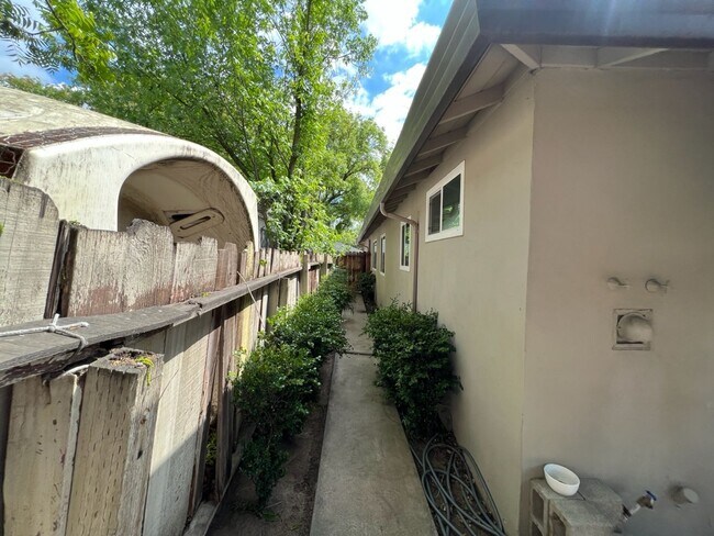 Building Photo - Two-bedroom single story unit with a carport!