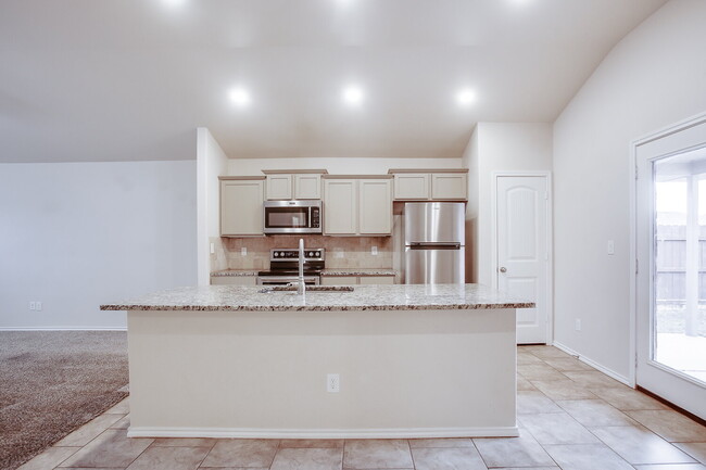 Building Photo - Granite Glam & Backyard Fun: Welcome to Yo...