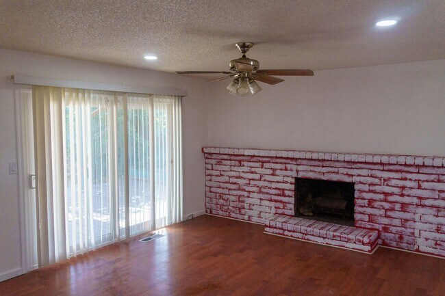 Building Photo - Spacious Three Bedroom, Two Bathroom House featuring Two Car Garage With Huge Yard