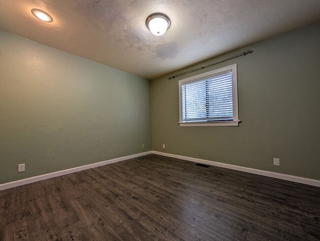 Building Photo - Updated 3-Bedroom, 2.5-Bath Home ~ Solid Surface Flooring and Spacious Kitchen!