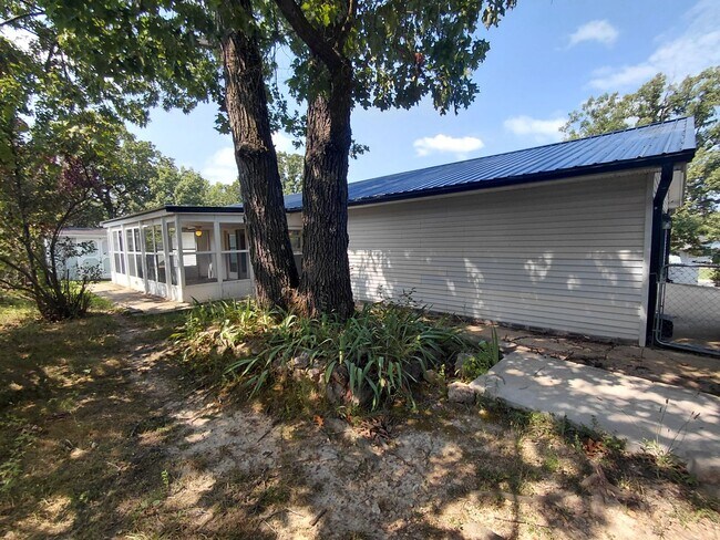 Building Photo - Fenced home close to post!