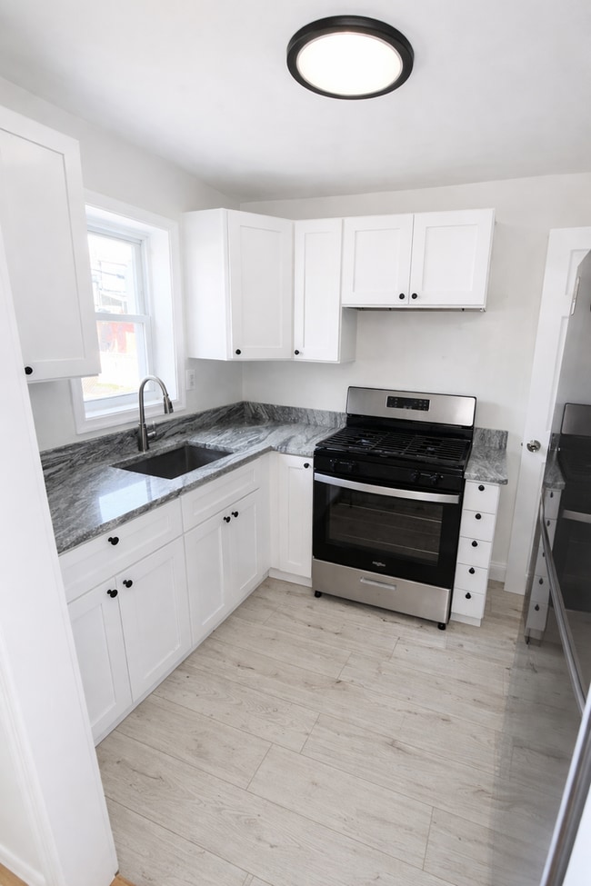 Building Photo - Renovated Home with Modern Kitchen, Basement & Natural Light