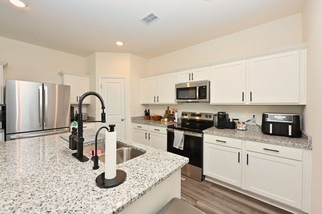 Building Photo - **RARE FIND: LIKE NEW, ONE-OWNER, 5-BED, 3-BATH HOME BUILT IN 2025 IN A NEIGHBORHOOD WITH RESORT-...