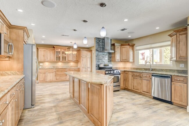 Building Photo - Gorgeous 4 Bedroom, 2 Story Home with a Beautiful Pool in the Lakes!