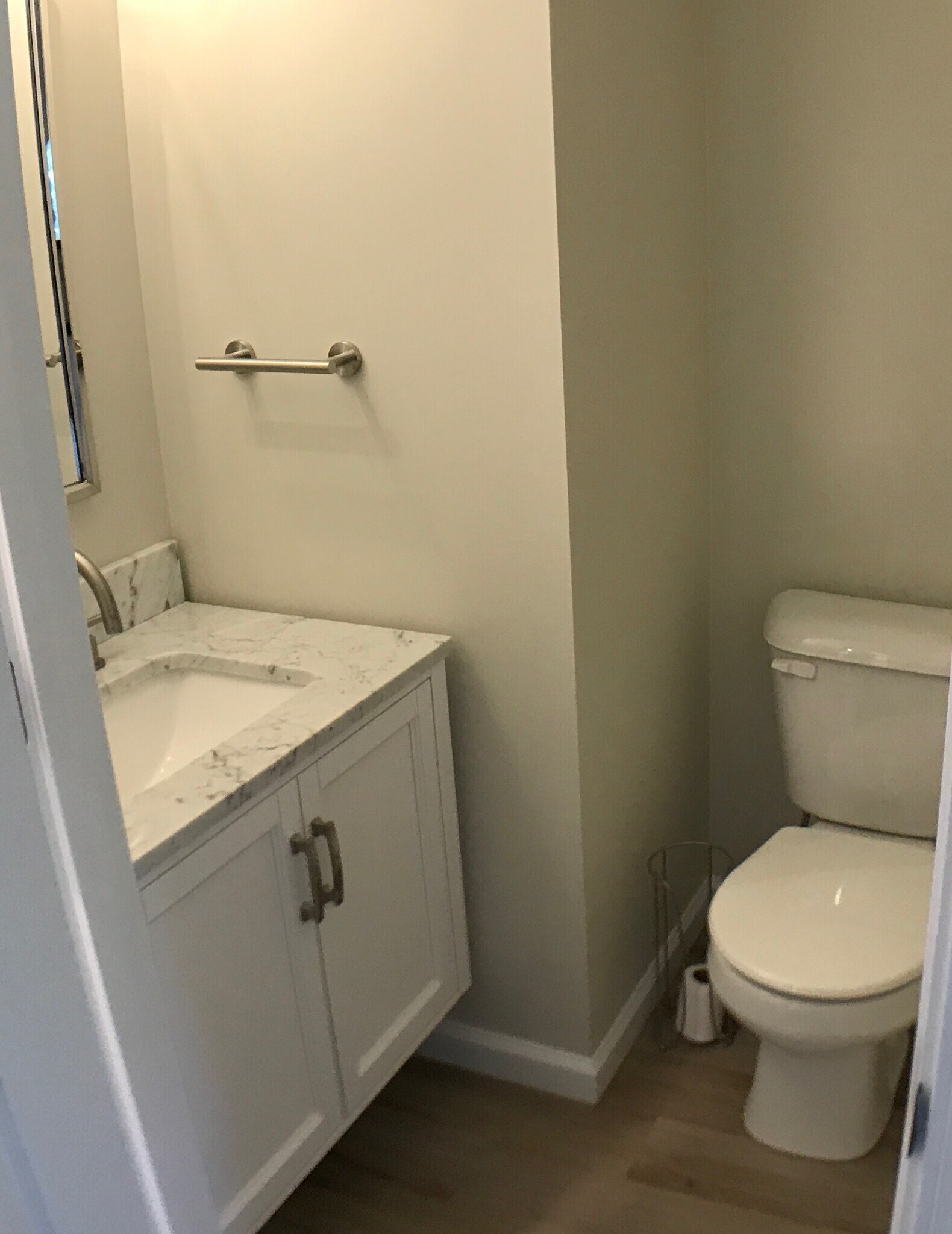 Half bath on first floor, marble vanity. - 3027 Abby Way