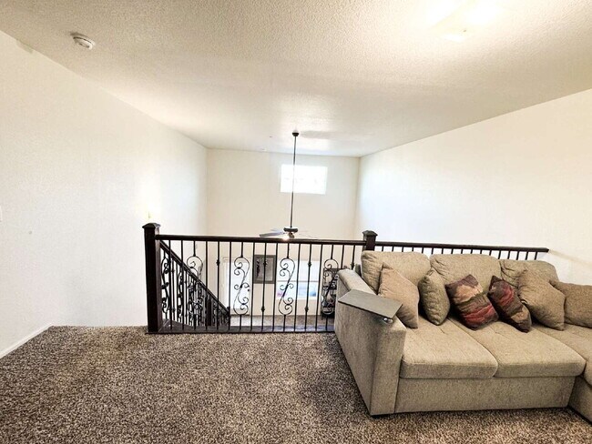 Building Photo - "Spacious 4-Bed, 3-Bath Condo in Desert Sky!"