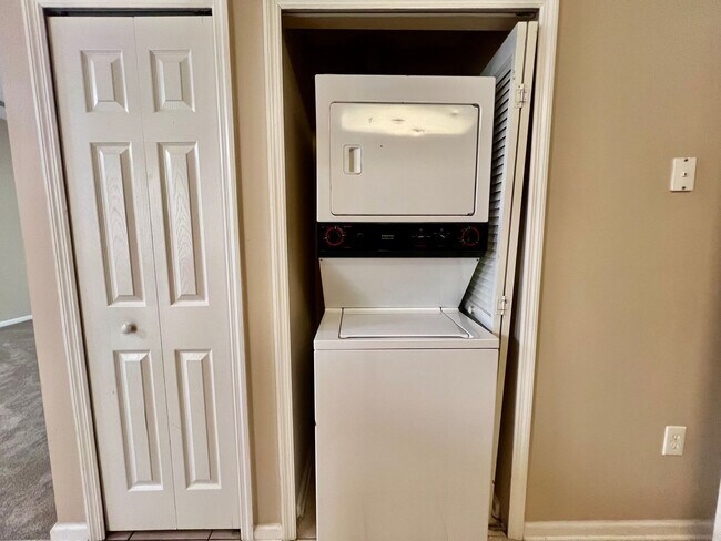 Building Photo - Gated Comfort Condo, Poolside Vibes: Your Next Home Awaits at Merrill Pines