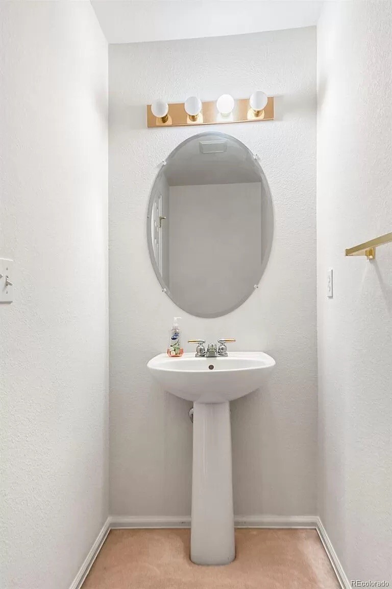 Main floor powder room - 2408 W 107th Dr