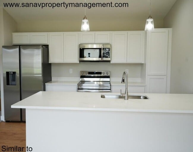 Building Photo - "Contemporary Ranch-Style Living: Immacula...