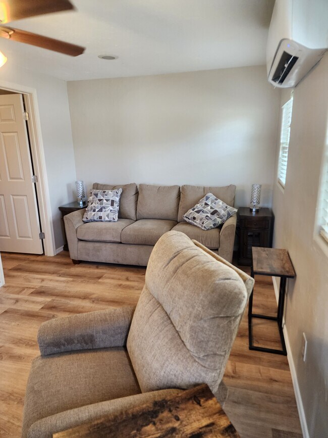 Couch is adjustable queen bed - 1100 N Lehmberg Ave