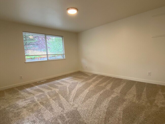 Building Photo - Stylishly Renovated Home with Private Back...