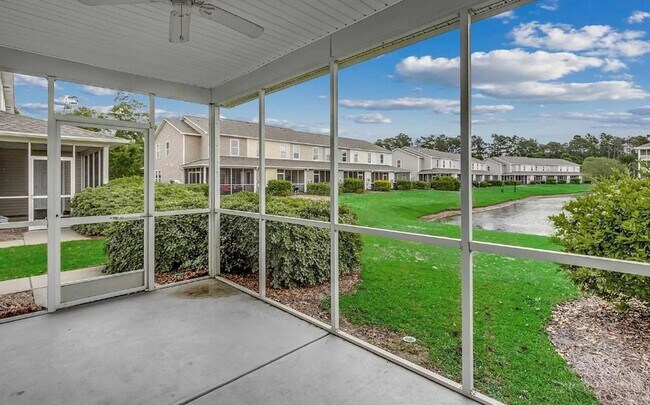 Building Photo - Relax and Unwind in this Spacious End-Unit...