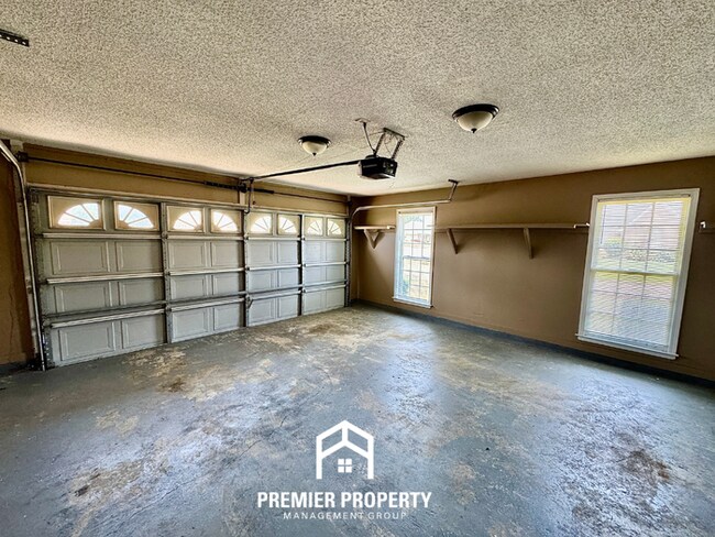 Building Photo - Spacious 3BR/2BA Near Southwind | 1,958 Sq Ft, Brick Fireplace, 2-Car Garage & Quiet Cove