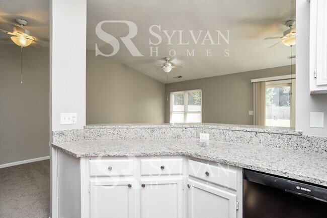 Building Photo - This home exudes a cheerful and welcoming charm!