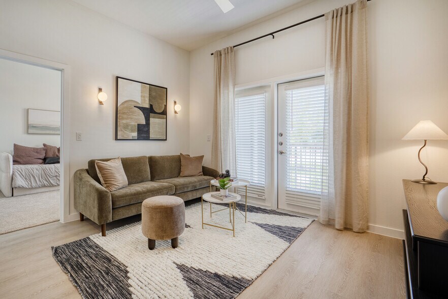 Spacious living room with an open, inviting layout at Sageland Flats at Brooks - Sageland Flats at Brooks