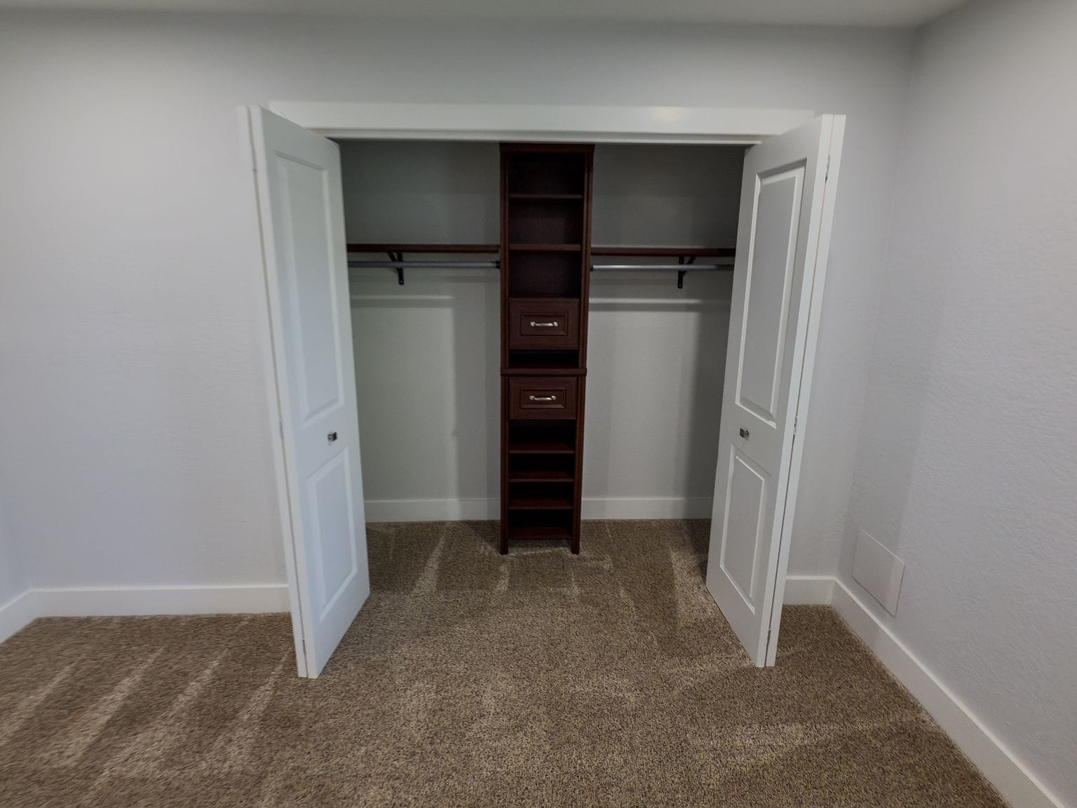 Closet with custom dark wood built-in organizer and shelving - 2006 Candle Ct