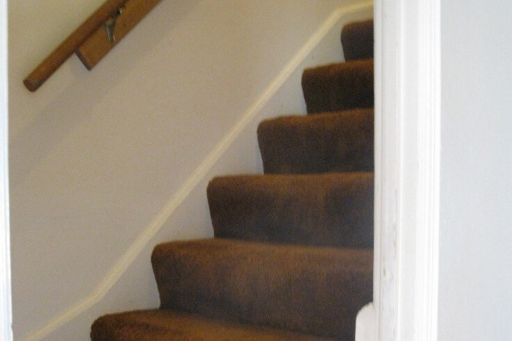 stairway from livingroom to bedrooms & bath - 2417 E 3rd St