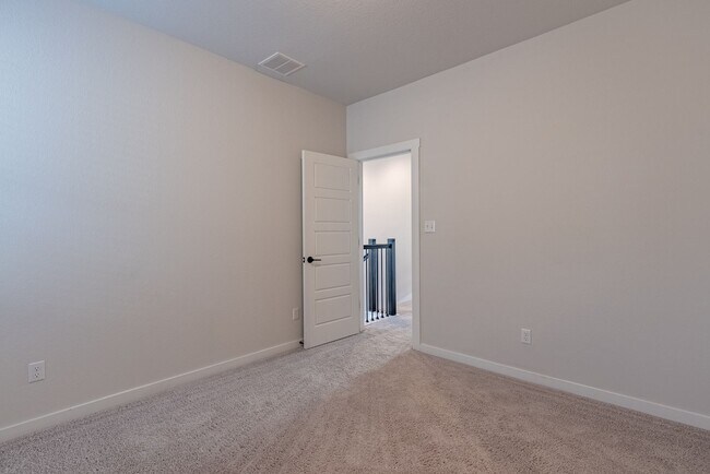 Building Photo - Spacious Buda Beauty Offering Open-Concept Living and Flexible Space for Every Lifestyle!