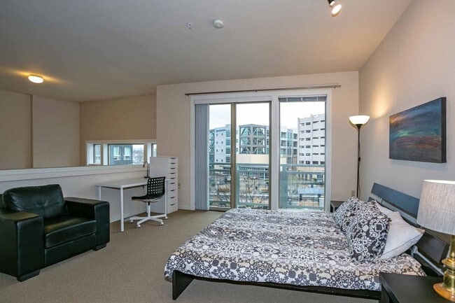 Building Photo - Gorgeous loft-style 2 floor condo with secured parking, A/C and rent includes most utilities!