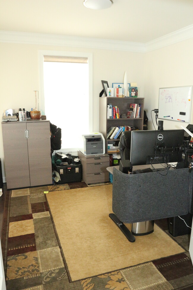 Main floor office with large windows and natural light all the way around! - 681 Fielding Run Dr