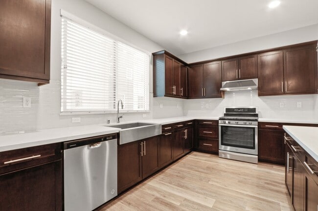 Building Photo - Gorgeous Tri-Level Townhome with Attached ...