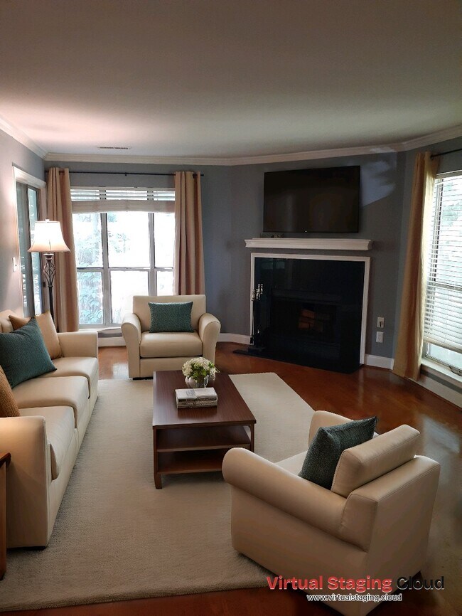 Staged living room w/fireplace and entry to balcony - 2514 Cranbrook Ln