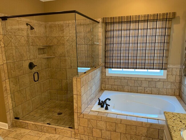 Building Photo - Luxury Living! Beautiful Brick Home in Sango with 3 car garage.