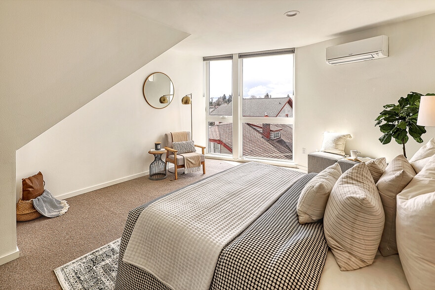 Floor to ceiling windows let the light in, up/down shades allow for sunshine and privacy - 818 N 47th St
