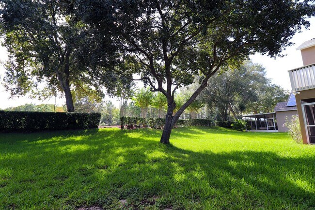 Building Photo - Beautiful 4-Bedroom Home in Gated Golf Community – East Orlando