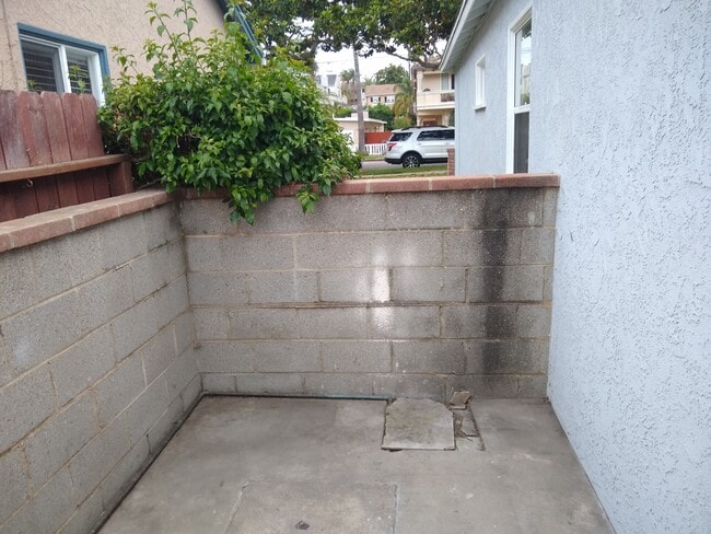 Back Patio around side of building - 512 N Lucia Ave