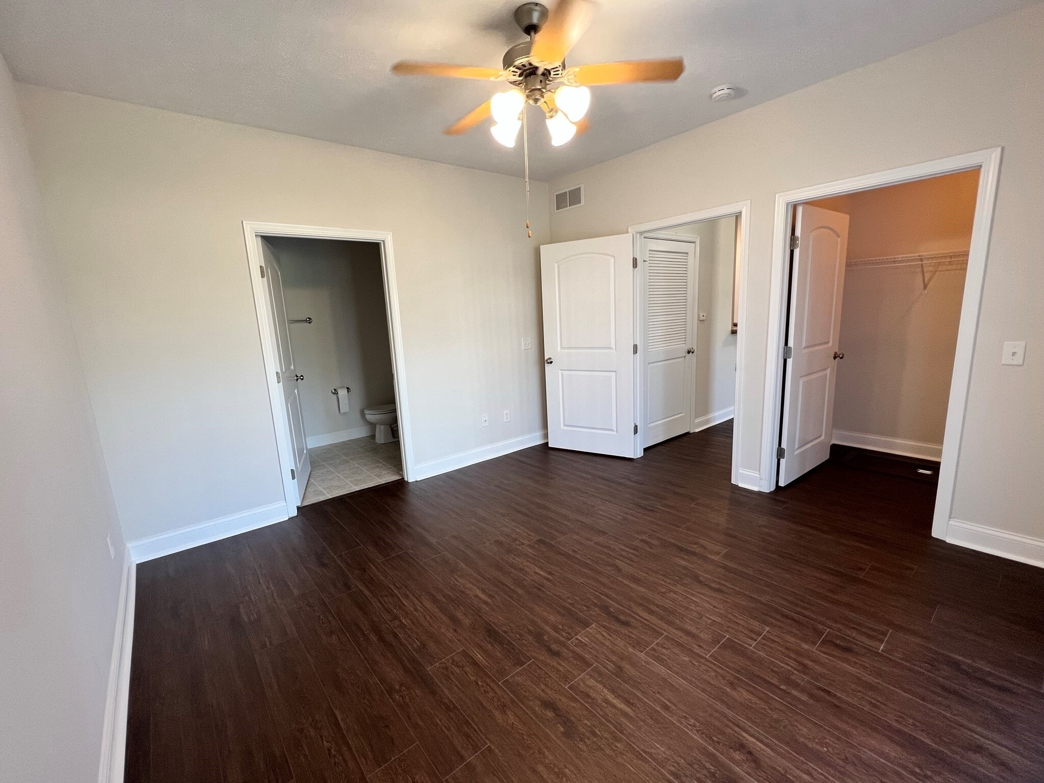Primary bedroom with walk in closet and on suite bathroom - 3020 E Stillwater Lndg