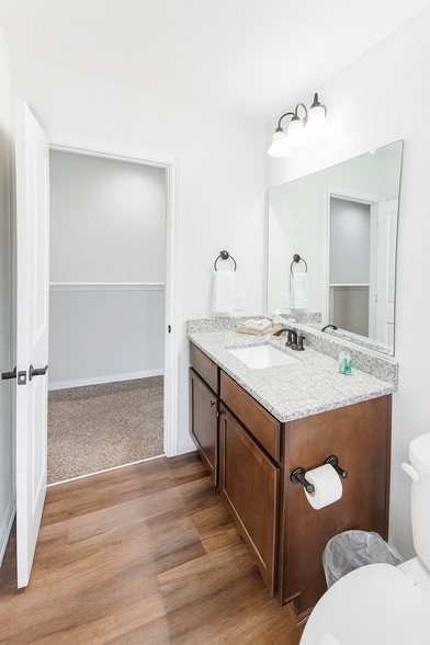 1 of 3 bathrooms. 2 full bathrooms and 1 half bathroom in common area. - 13810 Enzo Gate