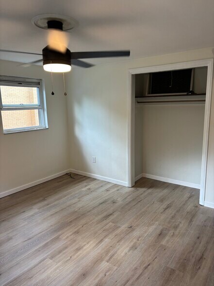 Bedroom 1 - ceiling fan and new LVT flooring - 244 Clairmont Ave