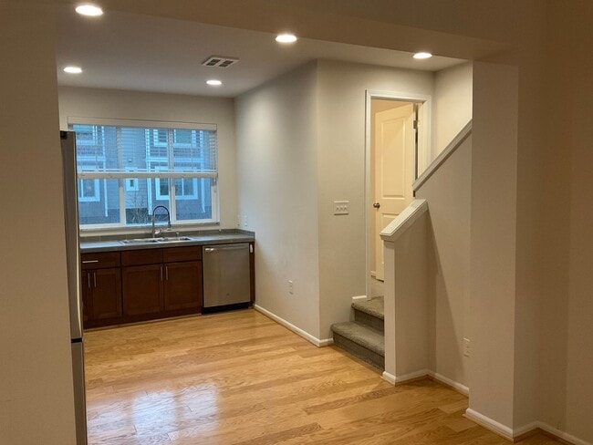 Building Photo - Riverfront Townhome with Tandem Garage & Fenced Yard