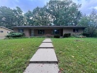 Building Photo - Two Bedroom Duplex SE Side w/ Decorative Fireplace! One Stall in Garage!