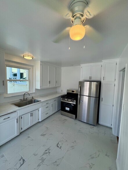 new tile floors - 3049 Community Ave