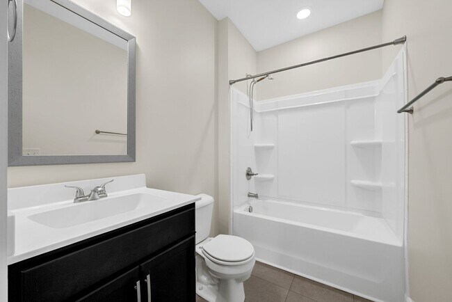 Building Photo - Pet Friendly Three Bedroom with Bonus!
