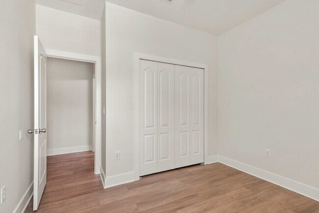 Building Photo - Expansive 4 bedroom, 3 bath remodeled home in gated community
