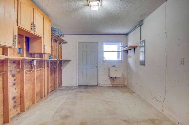 Building Photo - Live the Gulf Breeze Waterfront Life – Dock, Canal Access & Boat Lift!