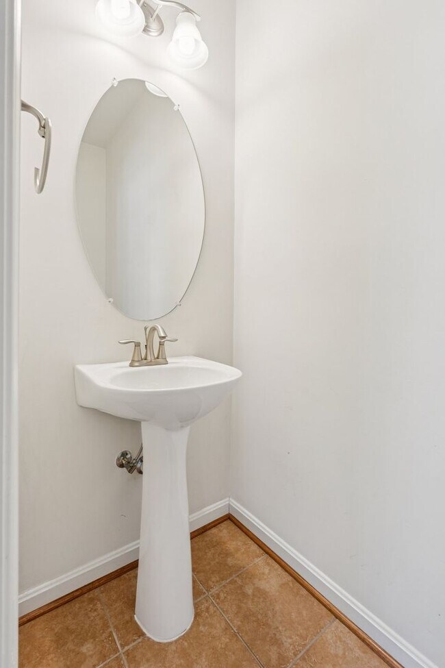 Building Photo - This beautifully maintained end-unit brick...