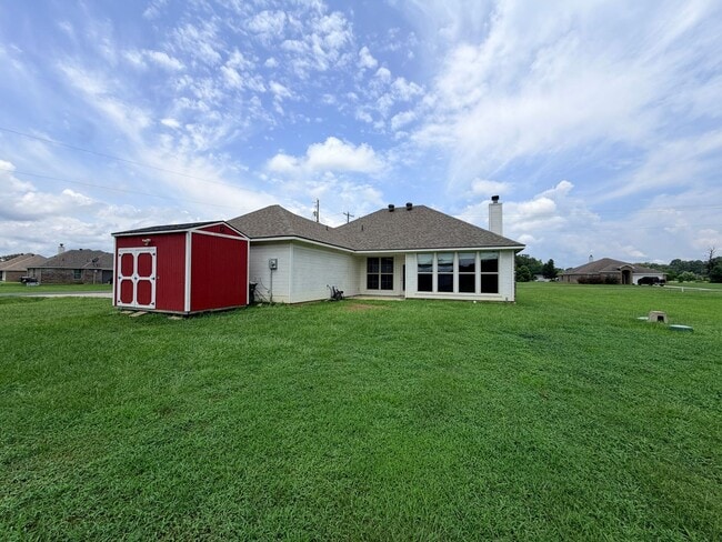 Building Photo - Large lot with Shop for boat or Atvs......