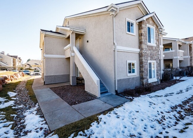 Building Photo - 3 Bed Top Floor Condo near Ft. Carson in Gated Community with detached Garage