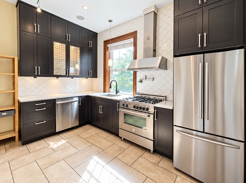 Additional kitchen views with potfiller, dishwasher, gas range and professional hood. - 2322 1st St NW