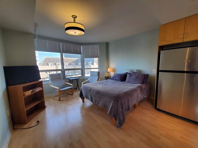 Building Photo - Downtown High-Rise Studio with parking and in-home laundry