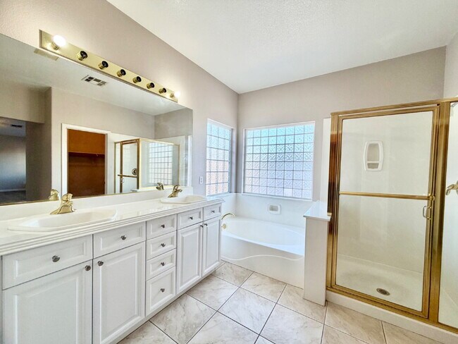 Building Photo - GATED SUMMERLIN HOME | 5 BEDROOM + DOWNSTAIRS DEN | 3-CAR GARAGE