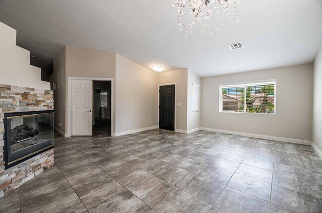 Building Photo - STUNNING 3 Bedroom Home with a 3 CAR GARAGE & RV PARKING!