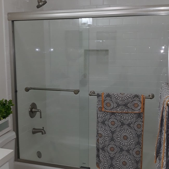 Kohler tub and subway tiled shower walls with - 4727 W 147th St