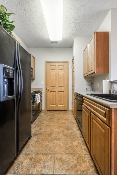 Our kitchens make meal prep a breeze, with easy access to all appliances and ample storage space to keep everything organized. - Stone Ridge Estates